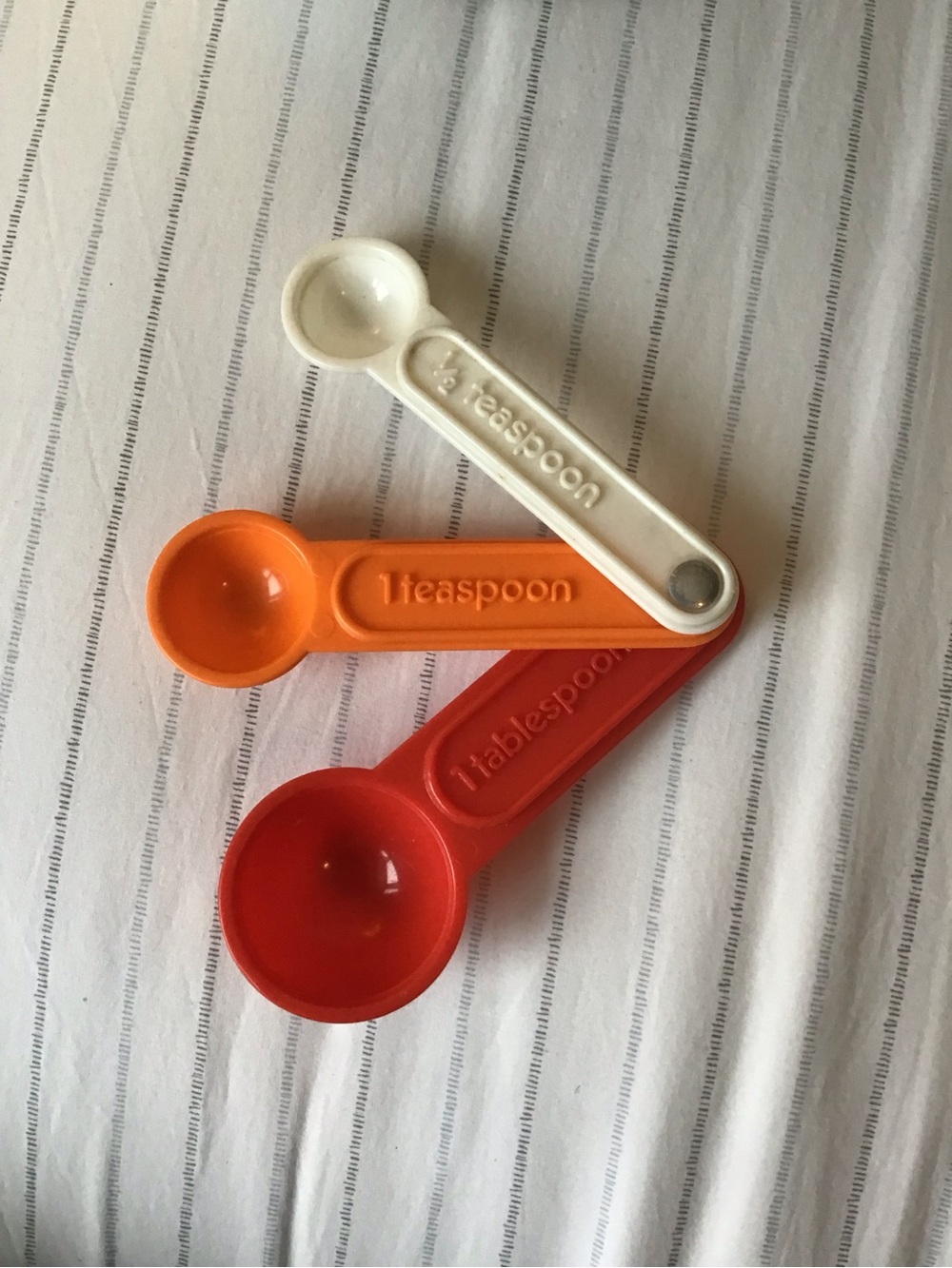 Set of Orange, Red, and Cream Measuring Spoons - Kids Toys vintage